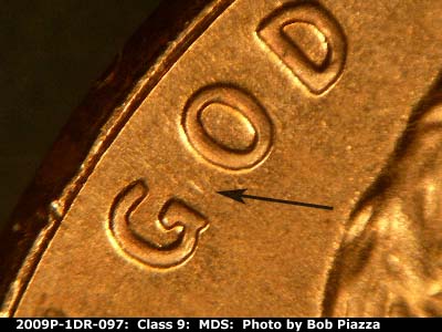 Die-stage B marker on 2009P•1DR•097 (2009 Doubled Die Reverse).