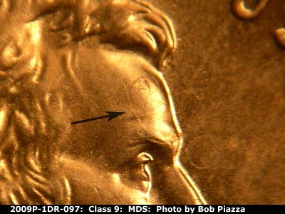 Die-stage B marker on 2009P•1DR•097 (2009 Doubled Die Reverse).