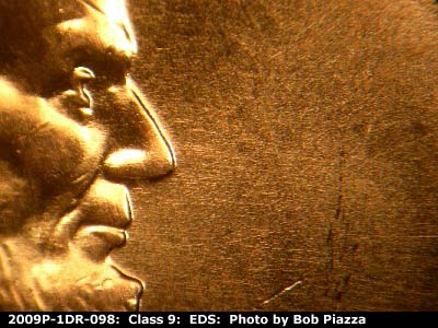 Die-stage A marker on 2009P•1DR•098 (2009 Doubled Die Reverse).