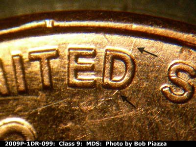 Die-stage B marker on 2009P•1DR•099 (2009 Doubled Die Reverse).