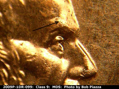 Die-stage B marker on 2009P•1DR•099 (2009 Doubled Die Reverse).