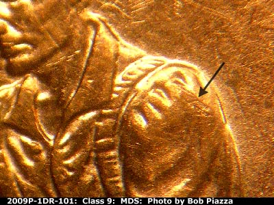 Die-stage B marker on 2009P•1DR•101 (2009 Doubled Die Reverse).