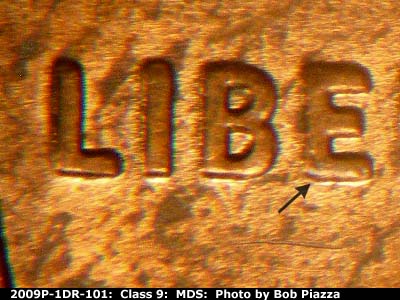 Die-stage B marker on 2009P•1DR•101 (2009 Doubled Die Reverse).