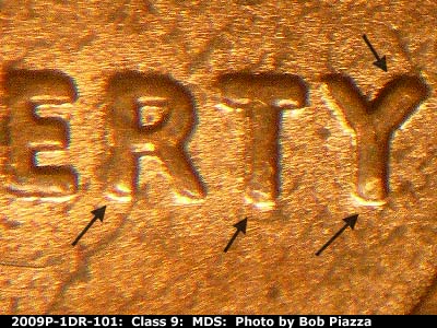 Die-stage B marker on 2009P•1DR•101 (2009 Doubled Die Reverse).