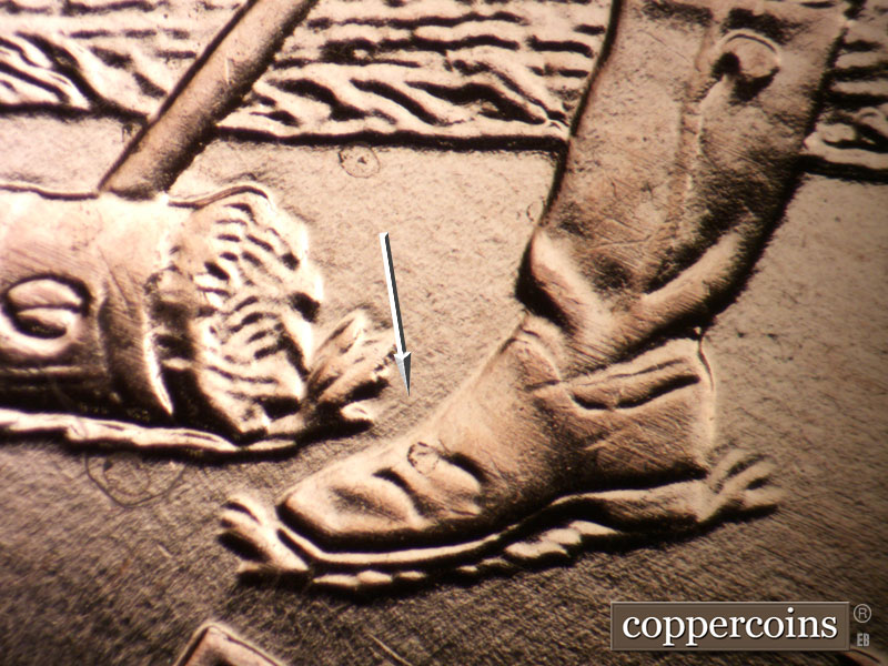 Die-stage A marker on 2009P•1DR•103 (2009 Doubled Die Reverse).