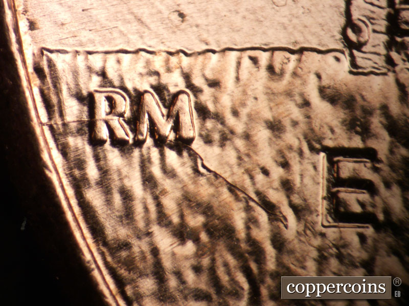 Die-stage B marker on 2009P•1DR•104 (2009 Doubled Die Reverse).