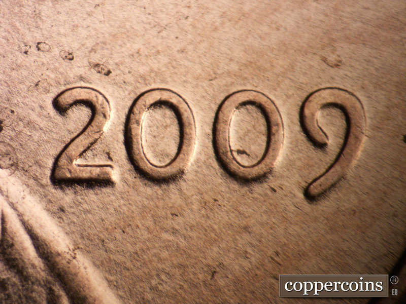 Die-stage B marker on 2009P•1DR•104 (2009 Doubled Die Reverse).
