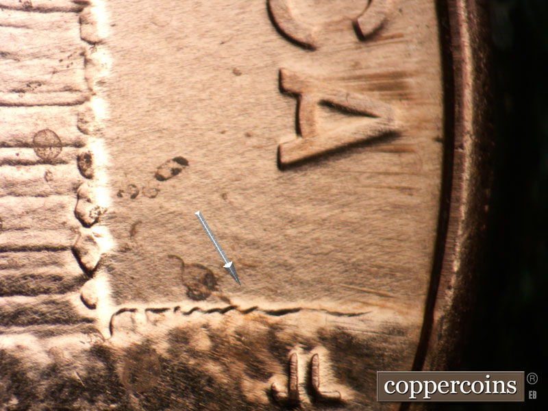 Die-stage B marker on 2009P•1DR•105 (2009 Doubled Die Reverse).