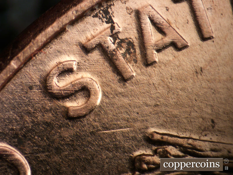 Die-stage B marker on 2009P•1DR•105 (2009 Doubled Die Reverse).