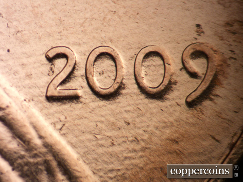Die-stage B marker on 2009P•1DR•105 (2009 Doubled Die Reverse).