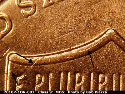 Die-stage B marker on 2010P•1DR•002 (2010 Doubled Die Reverse).