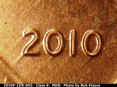Die-stage B marker on 2010P•1DR•002 (2010 Doubled Die Reverse).