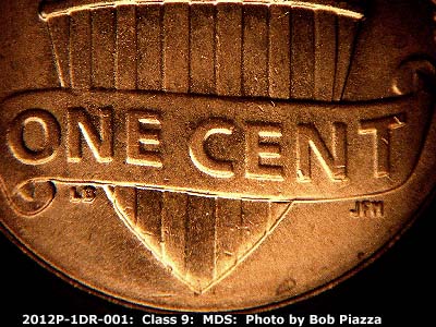 Die-stage B marker on 2012P•1DR•001 (2012 Doubled Die Reverse).