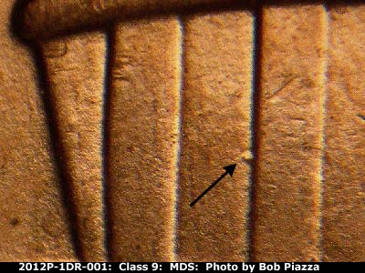 Die-stage B marker on 2012P•1DR•001 (2012 Doubled Die Reverse).