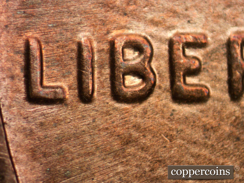 Die-stage B marker on 2013P•1DO•002 (2013 Doubled Die Obverse).