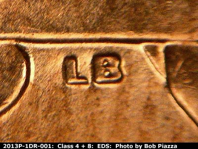 Die-stage A marker on 2013P•1DR•001 (2013 Doubled Die Reverse).