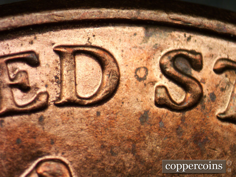Die-stage B marker on 2013P•1DR•001 (2013 Doubled Die Reverse).