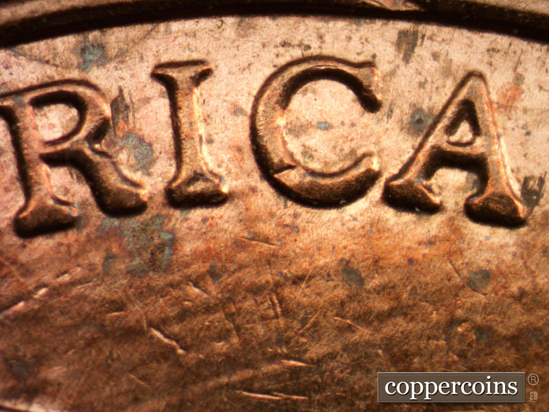Die-stage B marker on 2013P•1DR•001 (2013 Doubled Die Reverse).