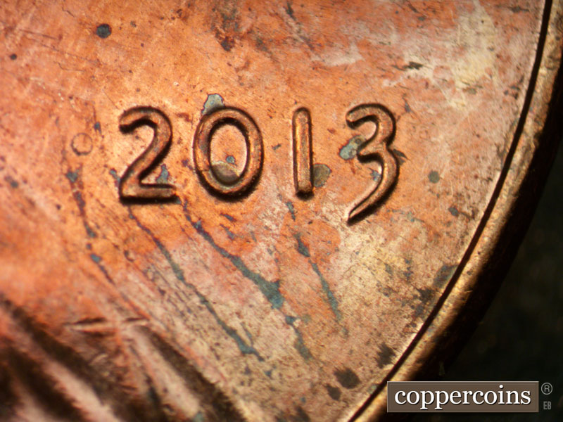 Die-stage B marker on 2013P•1DR•001 (2013 Doubled Die Reverse).