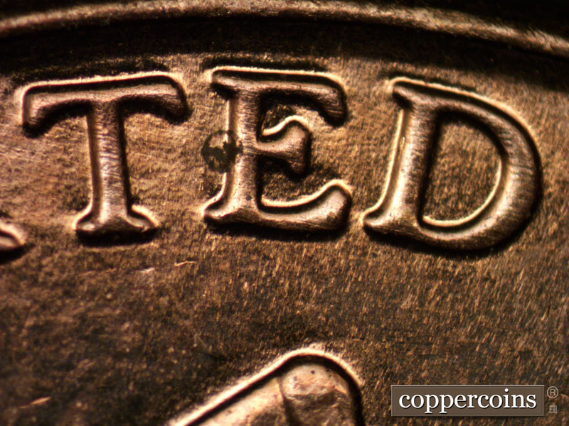 Die-stage B marker on 2013P•1DR•002 (2013 Doubled Die Reverse).
