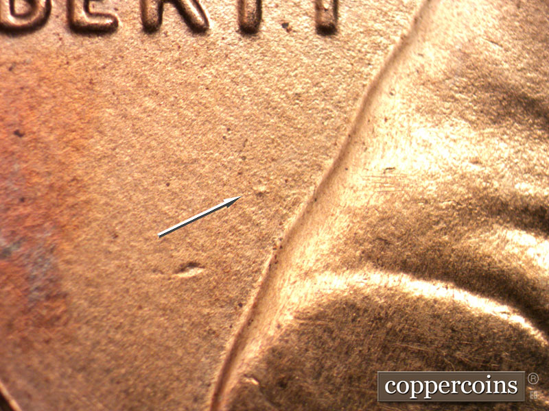 Die-stage B marker on 2013P•1DR•002 (2013 Doubled Die Reverse).