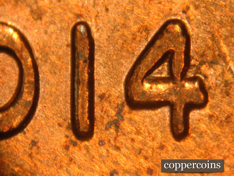 Die-stage B marker on 2014P•1DO•001 (2014 Doubled Die Obverse).