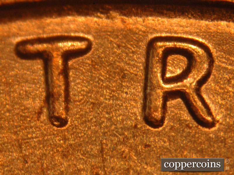 Die-stage B marker on 2014P•1DO•001 (2014 Doubled Die Obverse).