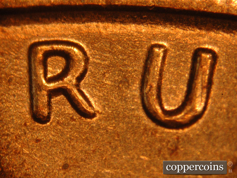 Die-stage B marker on 2014P•1DO•001 (2014 Doubled Die Obverse).
