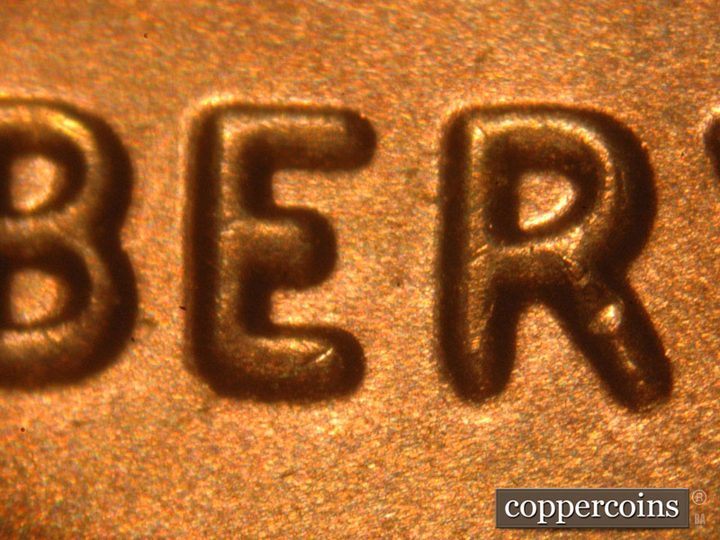 Die-stage B marker on 2014P•1DO•002 (2014 Doubled Die Obverse).