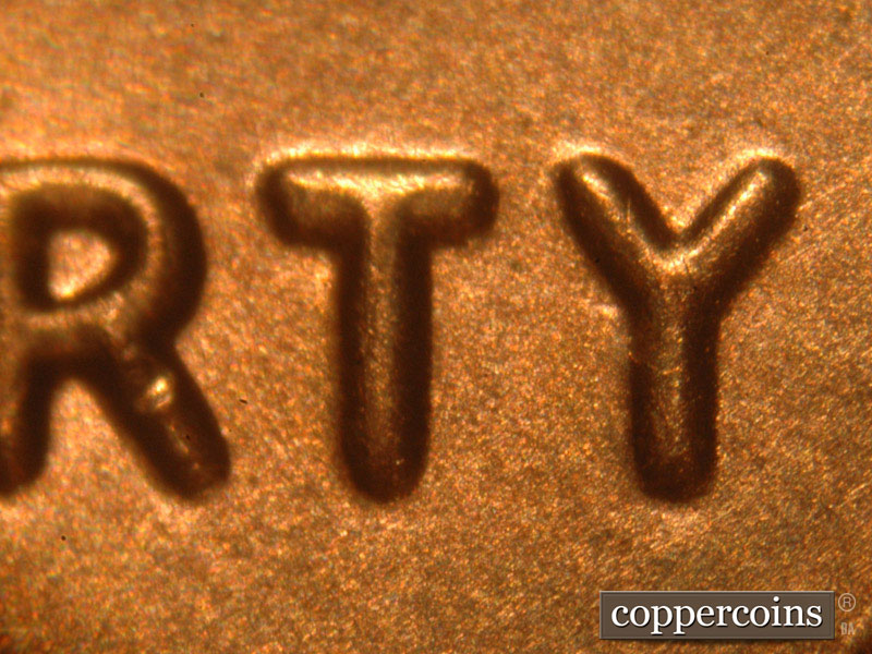 Die-stage B marker on 2014P•1DO•002 (2014 Doubled Die Obverse).