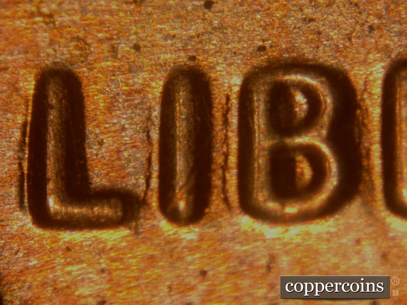 Die-stage B marker on 2014P•1DO•003 (2014 Doubled Die Obverse).