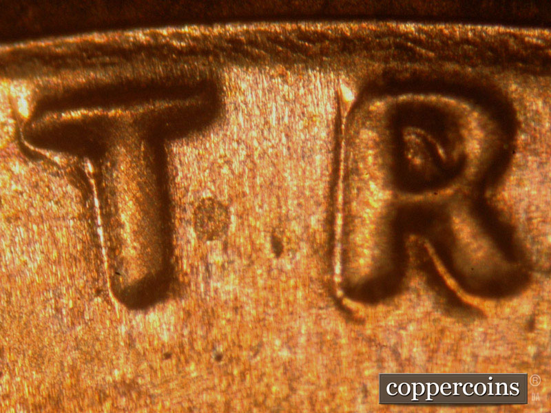 Die-stage B marker on 2014P•1DO•003 (2014 Doubled Die Obverse).