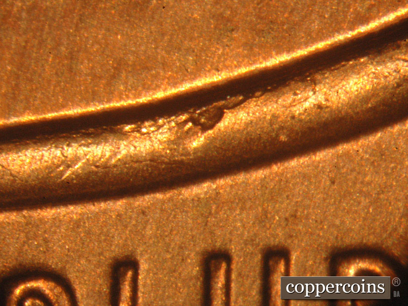 Die-stage B marker on 2014P•1DO•003 (2014 Doubled Die Obverse).