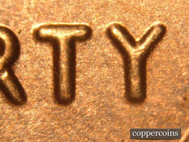 Die-stage C marker on 2014P•1DO•007 (2014 Doubled Die Obverse).
