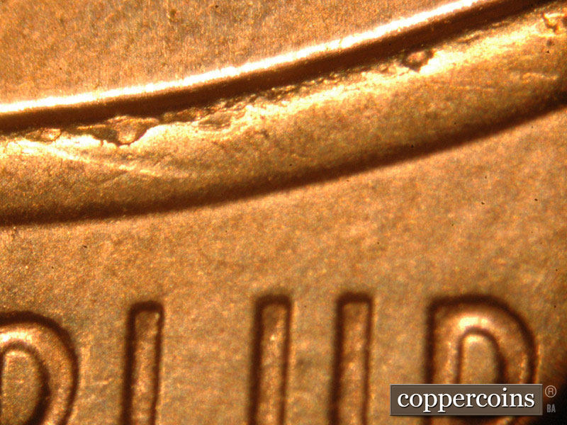 Die-stage C marker on 2014P•1DO•007 (2014 Doubled Die Obverse).