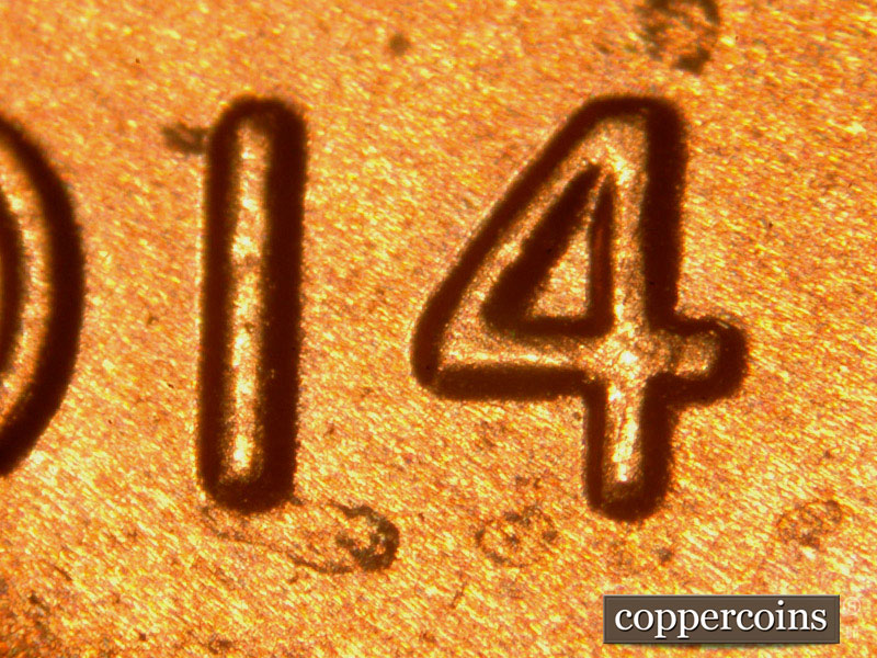 Die-stage B marker on 2014P•1DO•009 (2014 Doubled Die Obverse).