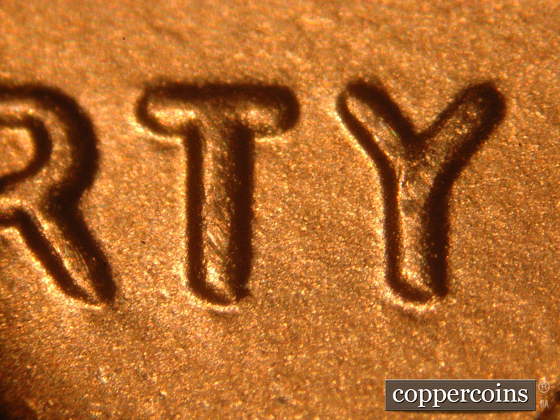 Die-stage B marker on 2014P•1DO•009 (2014 Doubled Die Obverse).