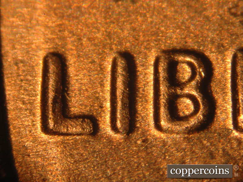 Die-stage B marker on 2014P•1DO•009 (2014 Doubled Die Obverse).