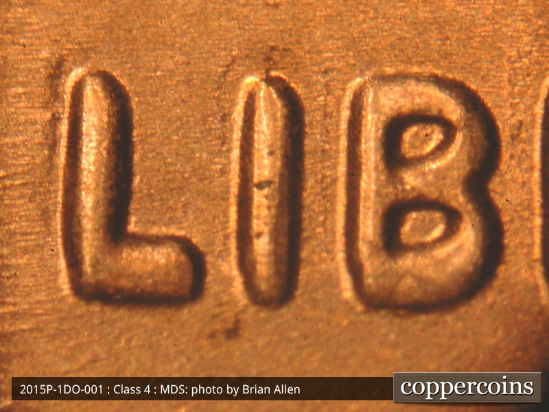 Die-stage B marker on 2015P•1DO•001 (2015 Doubled Die Obverse).
