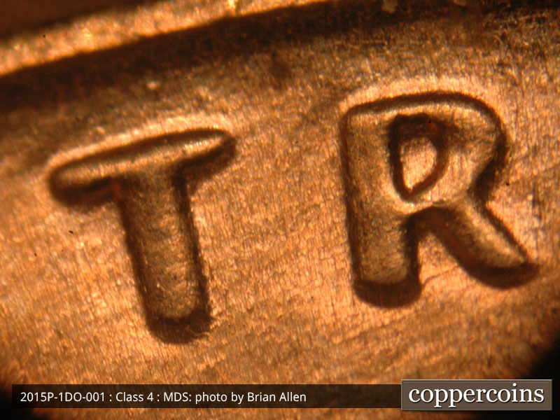 Die-stage B marker on 2015P•1DO•001 (2015 Doubled Die Obverse).