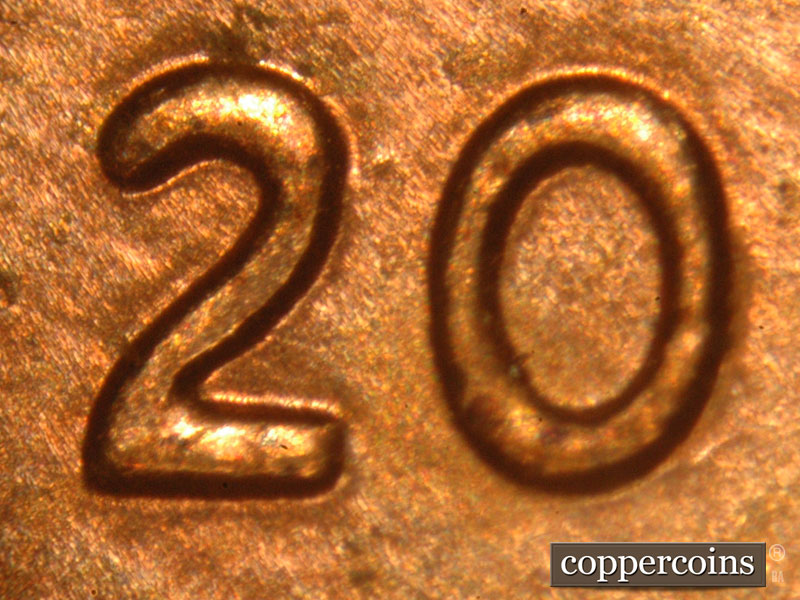 Die-stage C marker on 2015P•1DO•003 showing A very obvious spread on the 2 and 0 of the date.