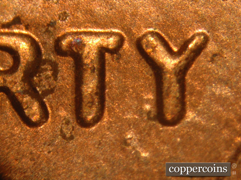 Die-stage C marker on 2015P•1DO•003 showing A very strong spread on all of LIBERTY. The left arm of the Y is much thicker that the right.