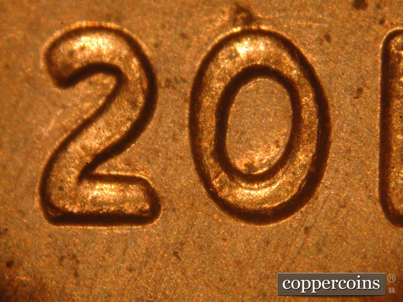 Die-stage C marker on 2015P•1DO•004 showing Very strong doubling is seen on the date.
