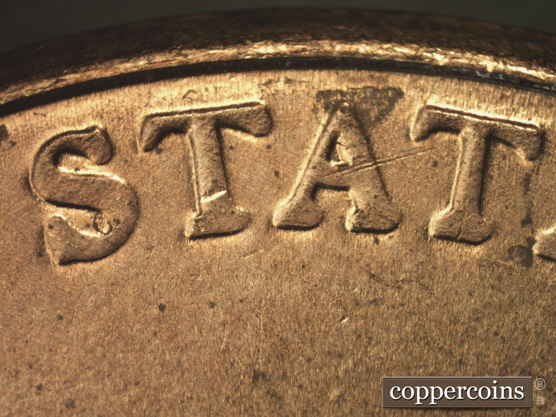 Die-stage B marker on 2015P•1DR•001 showing A strong spread seen on UNITED STATES OF AMERICA. Notice the wide lower serifs.