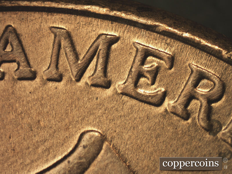Die-stage B marker on 2015P•1DR•001 showing A strong spread seen on UNITED STATES OF AMERICA. Notice the wide lower serifs.