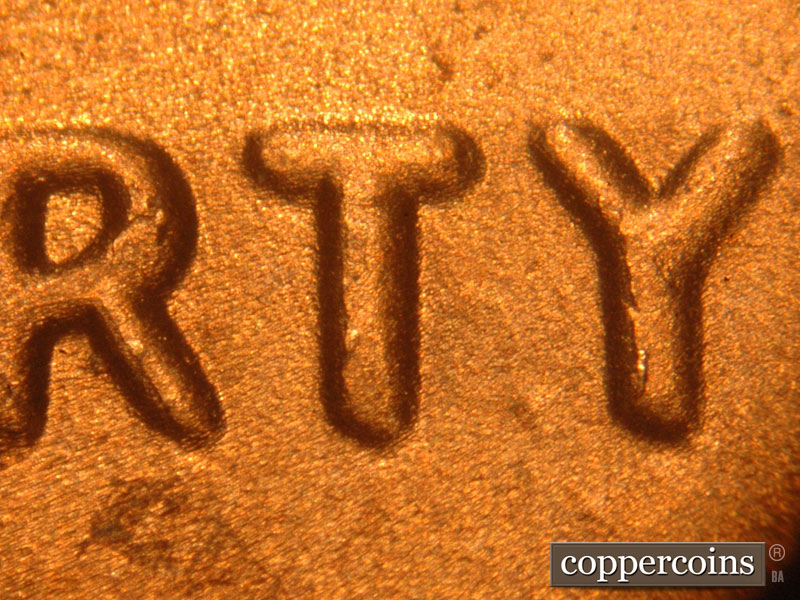 Die-stage C marker on 2016P•1DO•004 showing A spread is seen on LIBERTY. The right arm of the Y is thicker than the left.