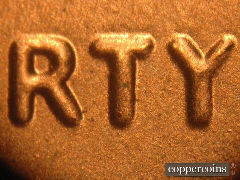 Die-stage B marker on 2016P•1DO•005 showing Spread on LIBERTY. The left arm of the Y is thicker than the right arm.