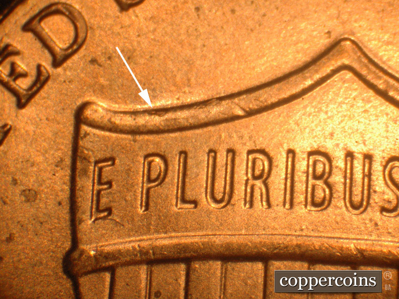 Die-stage B marker on 2016P•1DO•013 showing Die chipds on the top of the shield with a larger one above the P.