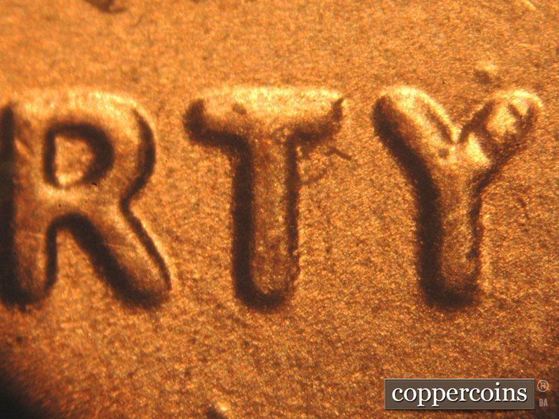 Die-stage B marker on 2017P•1DO•004 showing A spread is seen on LIBERTY. The arms of the Y are close in width.