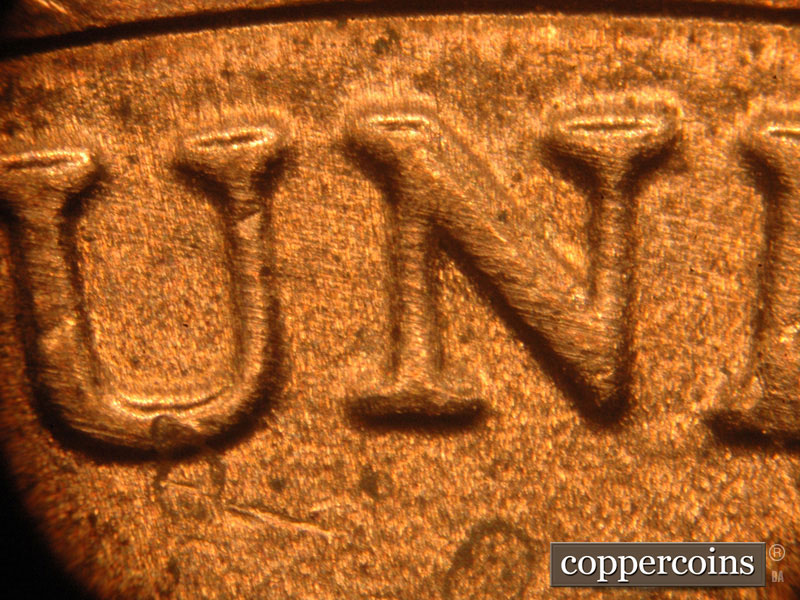 Die-stage C marker on 2018D•1DR•001 (2018 Doubled Die Reverse).